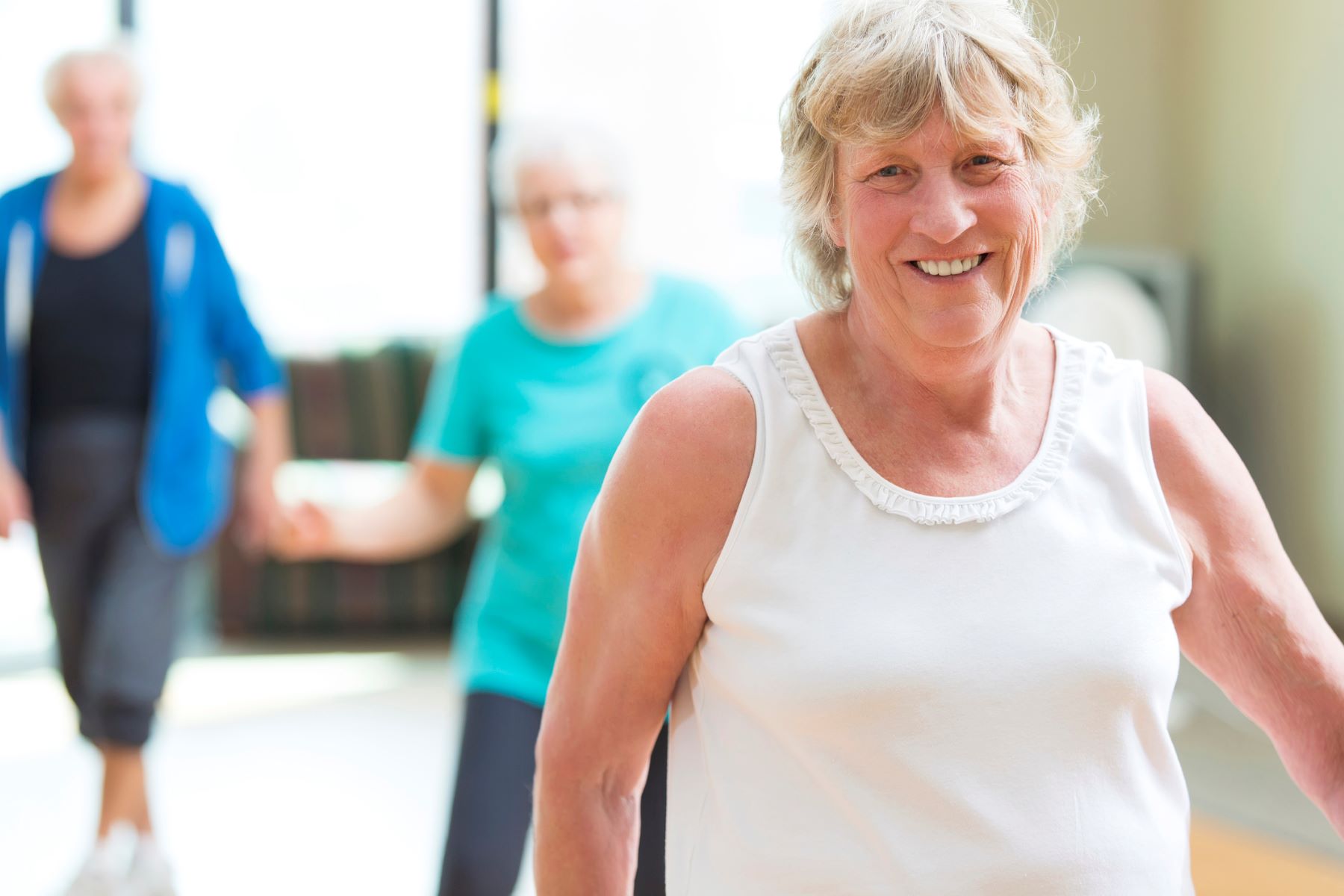 smiling senior woman at an exercise class