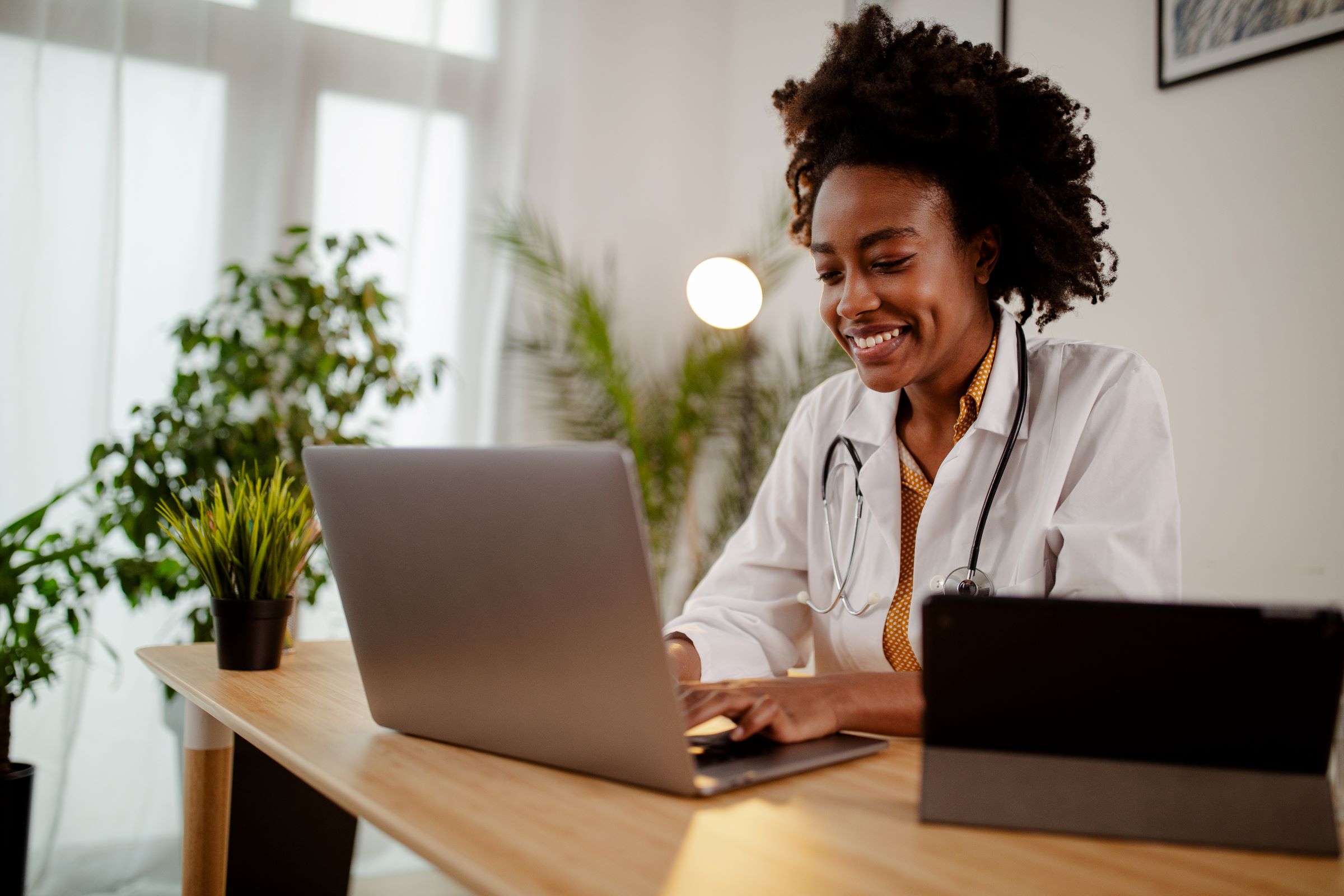 older male doctor smiling at patient