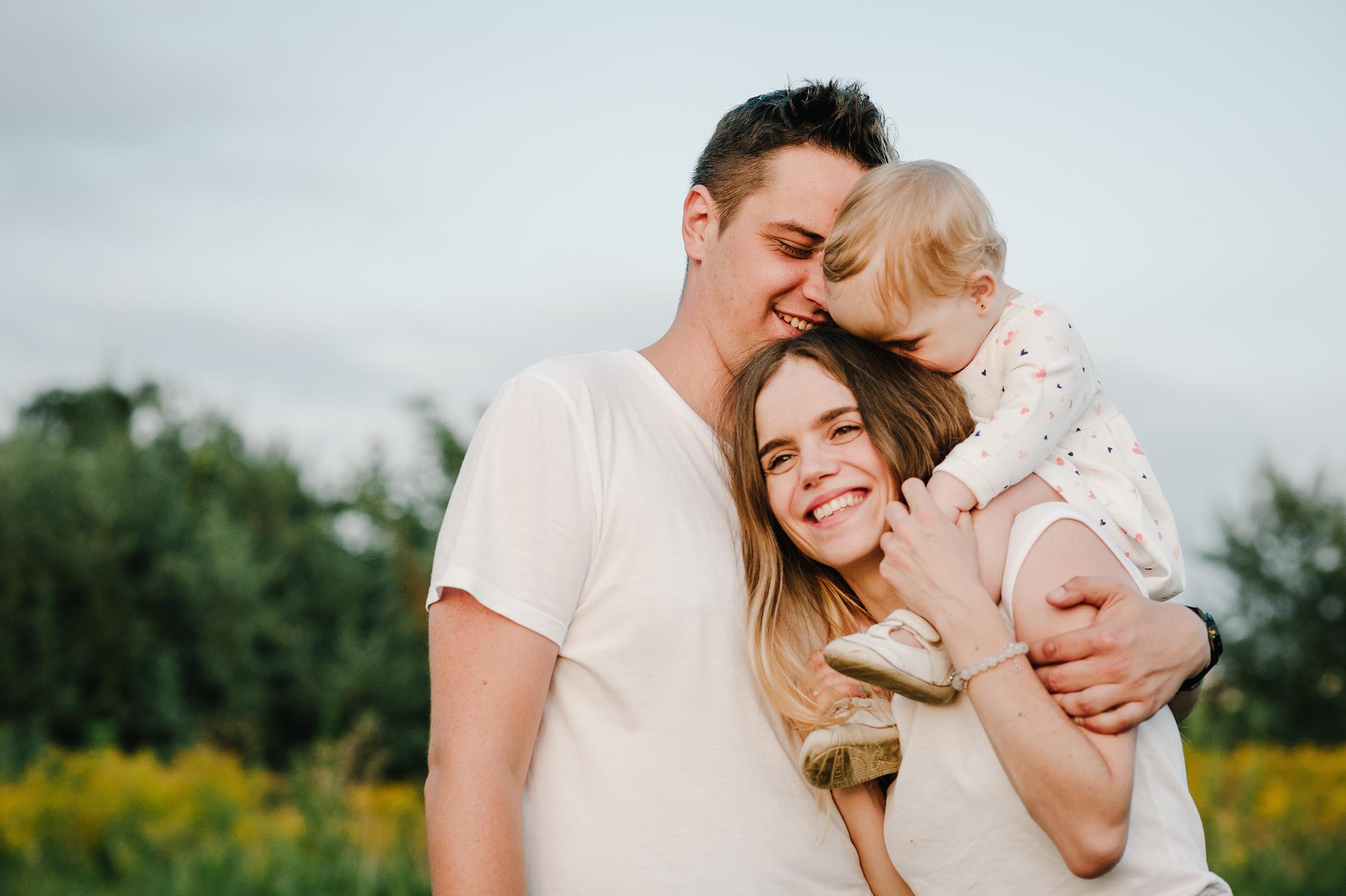 Young smiling couple with toddler